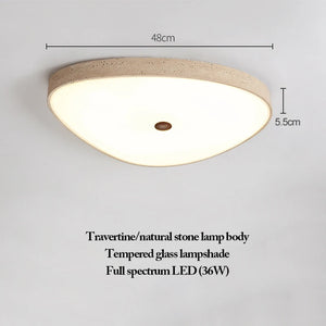 The Natural Stone Ceiling Light is a triangular ceiling fixture, crafted from either travertine or natural stone and paired with a tempered glass shade. Showcasing elegant wabi-sabi aesthetics, it features a powerful 36W full-spectrum LED and measures 48cm in width and 5.5cm in height—infusing any room with refined illumination and organic beauty.