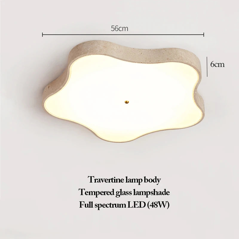 The Natural Stone Ceiling Light features a cloud-shaped travertine body, a tempered glass lampshade, and a full spectrum 48W LED. Measuring 56cm wide and 6cm tall, this wabi-sabi fixture adds organic beauty and timeless elegance to any space.