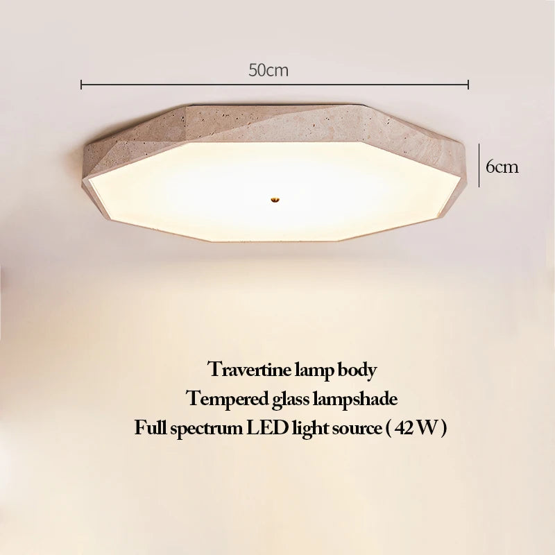Natural Stone Ceiling Light features an octagonal design with a refined body crafted from natural travertine, complemented by a tempered glass shade and an energy-efficient 42W full spectrum LED. Measuring 50cm wide and 6cm high, this wabi-sabi fixture blends organic materials with understated elegance.