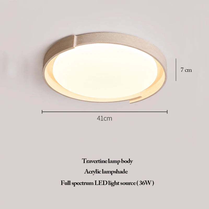 The Natural Stone Ceiling Light features a circular travertine body with a natural stone finish and an acrylic lampshade. Measuring 41 cm in width and 7 cm in height, it is equipped with a 36W full spectrum LED light source. This wabi-sabi-inspired fixture brings organic elegance and timeless style to any interior.