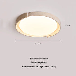 The Natural Stone Ceiling Light features a circular travertine body with a natural stone finish and an acrylic lampshade. Measuring 41 cm in width and 7 cm in height, it is equipped with a 36W full spectrum LED light source. This wabi-sabi-inspired fixture brings organic elegance and timeless style to any interior.
