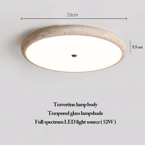 The Natural Stone Ceiling Light features a round travertine body, a tempered glass lampshade, and a full spectrum 52W LED. Inspired by wabi-sabi lighting principles, this fixture measures 53 cm in diameter and 5.5 cm in height.