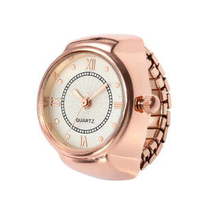 The Eternal Ring Watch features a rose gold analog design with Roman numerals and a flexible metal band, shown at an angle on a white background—a timeless piece for any jewelry watch collection.