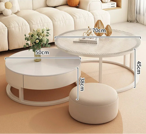 The Luxury Round Coffee Table Set is shown in a living room, featuring two minimalist white tables (70cm diameter, heights 45cm and 38cm) and a round ottoman measuring 50cm high.
