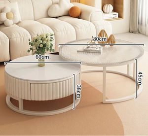 The Luxury Round Coffee Table Set features two minimalist tables for your living room: a smaller table (60cm wide, 38cm tall) and a larger table (80cm wide, 45cm tall).