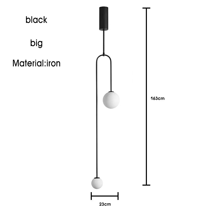 The Minimalist Line Light features a modern black iron pendant design with two spherical bulbs. Its sculptural aesthetic, standing 163cm tall and 23cm wide, makes it a stylish centerpiece for any space.