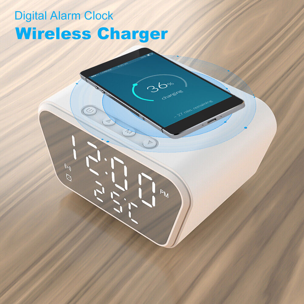 A digital alarm clock with wireless charging capabilities displaying the time and a smartphone resting on top, featuring iPhone and Android support for discreet monitoring.
