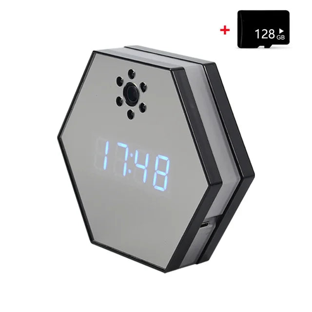 The Sleek Clock SpyCam is a hexagonal digital clock with a blue LED display showing 17:48, featuring a built-in 4K HD spy camera with infrared night vision and including a 128GB microSD card shown in the top right corner.