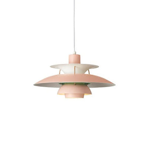 A pendant light hanging on a white wall, combining style and function with its pink and white design.